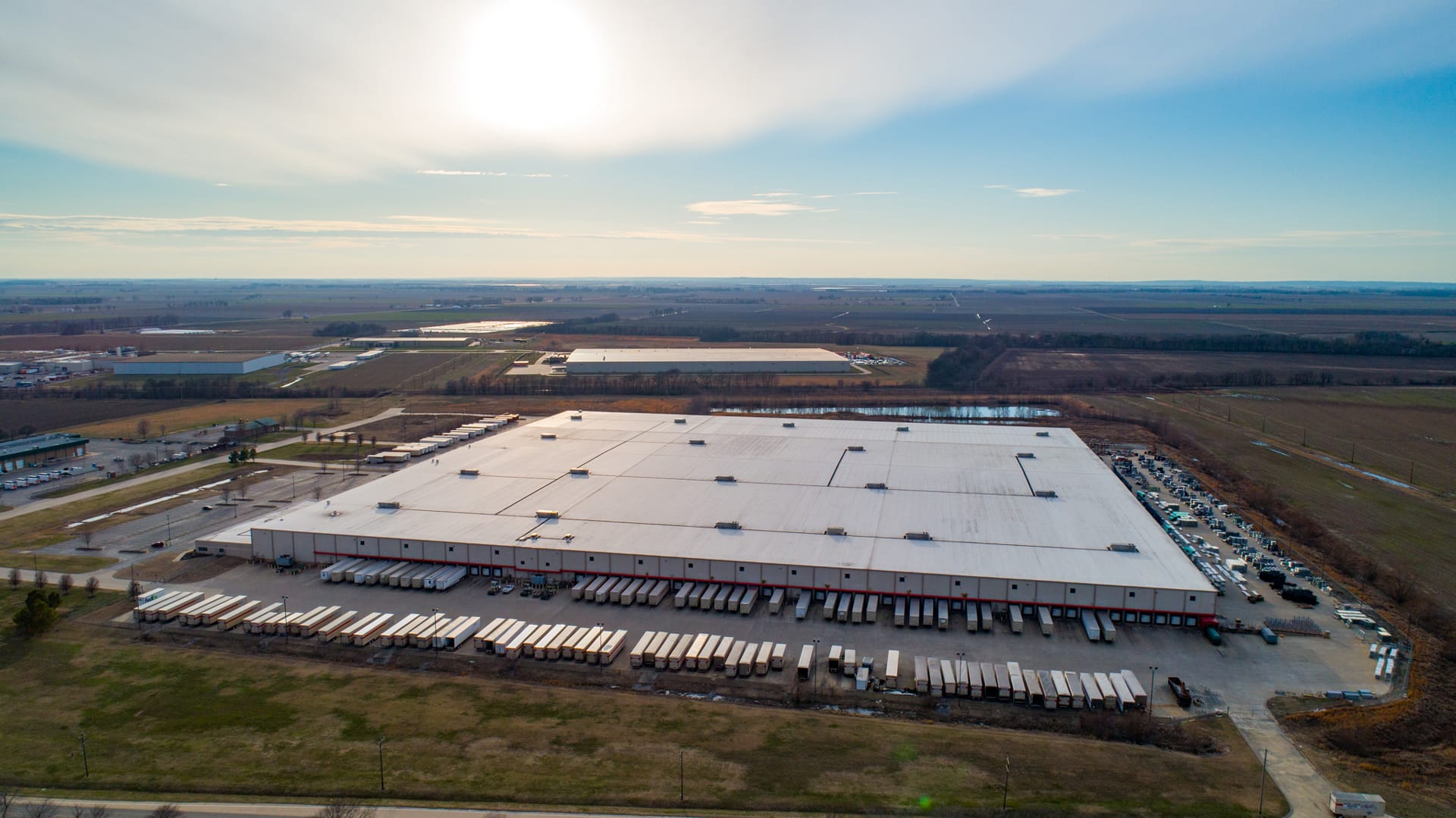 Aerial view of a large industrial Orgill Distribution Facility with the word